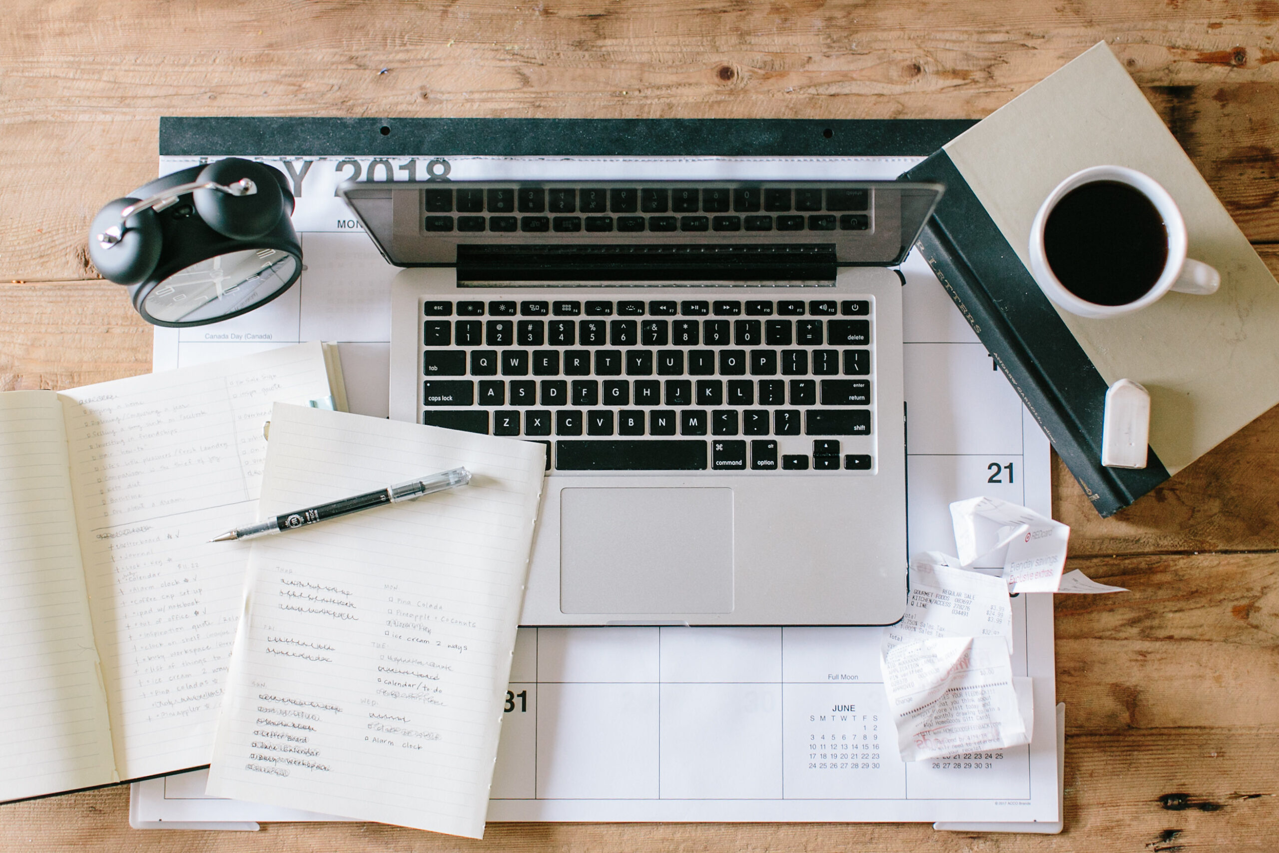 Office flatlay with laptop and, journal, and coffee. 7 valuable lessons I wish I knew before starting my business.